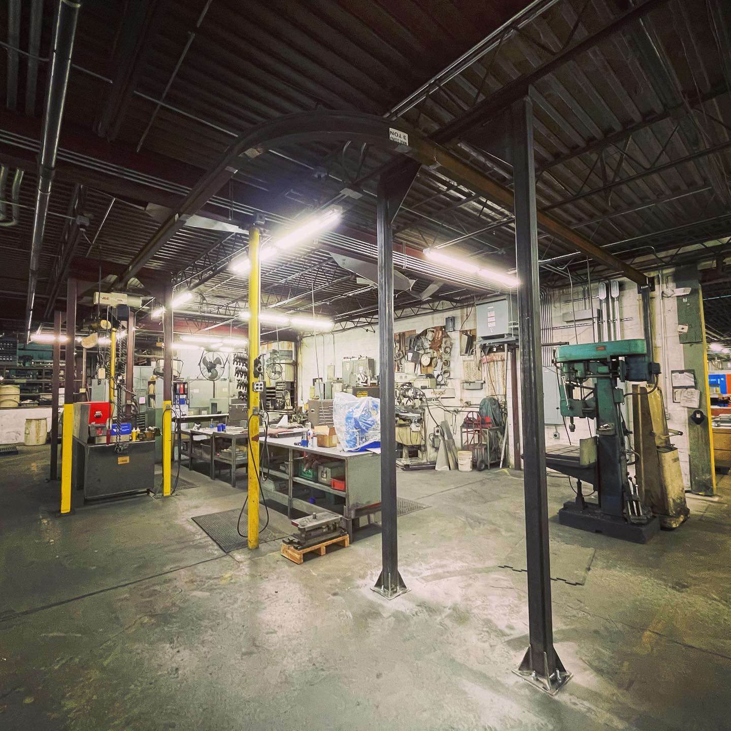 Custom steel fabrication parts on a welding table